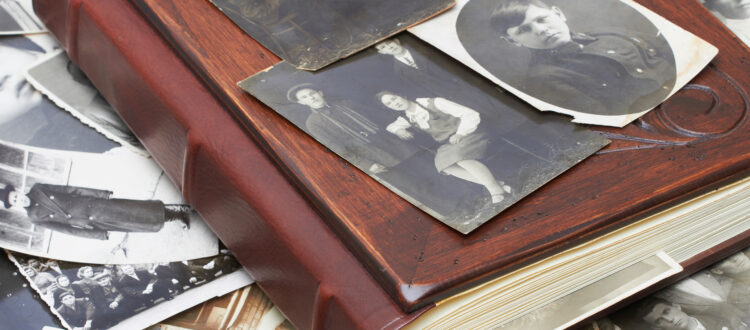 Close up of an album and ancient family photos